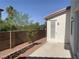 Cozy backyard featuring a brick retaining wall, stone pavers, and privacy walls at 3328 White Bark Pine St, Las Vegas, NV 89129