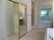 Bathroom showcasing walk-in shower, mirrored closet, dual sinks, and a large tub at 3328 White Bark Pine St, Las Vegas, NV 89129