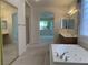 Elegant bathroom featuring a large tub, walk-in shower, and dual sinks at 3328 White Bark Pine St, Las Vegas, NV 89129
