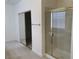 Bathroom showcasing a glass-enclosed shower and mirrored closet at 3328 White Bark Pine St, Las Vegas, NV 89129