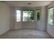 Bedroom with natural light and a view of lush greenery outside the windows at 3328 White Bark Pine St, Las Vegas, NV 89129
