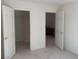 Carpeted bedroom featuring two doorways, one to the closet and one to the ensuite at 3328 White Bark Pine St, Las Vegas, NV 89129