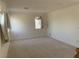 Spacious carpeted bedroom with bright window allowing for natural light and neutral paint at 3328 White Bark Pine St, Las Vegas, NV 89129