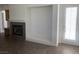 Open-concept kitchen featuring light wood cabinets, tile flooring, and fireplace at 3328 White Bark Pine St, Las Vegas, NV 89129