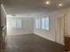 Bright living room featuring large windows with shutters and beautiful tiled flooring at 3328 White Bark Pine St, Las Vegas, NV 89129