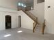 Spacious living room with high ceilings and staircase at 3328 White Bark Pine St, Las Vegas, NV 89129