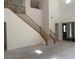 Bright living room featuring a staircase and high ceilings at 3328 White Bark Pine St, Las Vegas, NV 89129