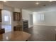View of living room featuring stone fireplace and tile floor with a desk nook at 3328 White Bark Pine St, Las Vegas, NV 89129