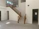 Bright living room featuring a staircase and high ceilings at 3328 White Bark Pine St, Las Vegas, NV 89129