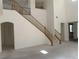 Bright living room featuring a staircase and high ceilings at 3328 White Bark Pine St, Las Vegas, NV 89129