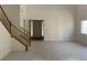 Open living room view shows staircase and entry featuring tile flooring at 3328 White Bark Pine St, Las Vegas, NV 89129