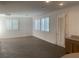 Bright living room featuring large windows with shutters and beautiful tiled flooring at 3328 White Bark Pine St, Las Vegas, NV 89129