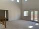 Bright living room boasts high ceilings, large windows, and a walkout patio at 3328 White Bark Pine St, Las Vegas, NV 89129