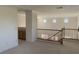 Loft area with a wood railing and ample natural light at 3328 White Bark Pine St, Las Vegas, NV 89129