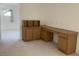 Dedicated carpeted office space with built-in cabinets, drawers, and desk at 3328 White Bark Pine St, Las Vegas, NV 89129