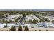An aerial view showcases this charming community with its lush landscaping and easy access to city amenities at 3380 Kensbrook St, Las Vegas, NV 89121