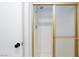 Shower in a bathroom with white tile and a gold-framed sliding door at 3380 Kensbrook St, Las Vegas, NV 89121