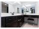 Contemporary bathroom with black cabinets, double sinks, and updated fixtures at 3380 Kensbrook St, Las Vegas, NV 89121