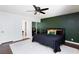 Comfortable bedroom with a ceiling fan, a large bed, and access to the ensuite bathroom at 3380 Kensbrook St, Las Vegas, NV 89121