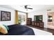 Bright bedroom with a sliding glass door to a courtyard and dark wood furniture at 3380 Kensbrook St, Las Vegas, NV 89121