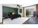 Bedroom with an accent wall, a ceiling fan, and a sliding glass door to a patio at 3380 Kensbrook St, Las Vegas, NV 89121