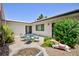 Private courtyard with seating area and mature landscaping at 3380 Kensbrook St, Las Vegas, NV 89121