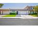 Charming home features a two-car garage, manicured lawn, and lovely front entrance at 3380 Kensbrook St, Las Vegas, NV 89121
