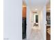 Hallway with tile flooring, neutral walls, and several doors at 3380 Kensbrook St, Las Vegas, NV 89121