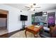 Office with ceiling fan, wood flooring, decorative wall art and a vintage desk at 3380 Kensbrook St, Las Vegas, NV 89121