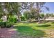 Community green space with park benches and shady trees at 3380 Kensbrook St, Las Vegas, NV 89121