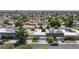 An inviting street view displaying well-kept homes, solar panels and mature landscaping in this desirable neighborhood at 3380 Kensbrook St, Las Vegas, NV 89121