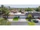 A pleasing street view featuring a home with an inviting curb appeal, a manicured lawn, and solar panels at 3380 Kensbrook St, Las Vegas, NV 89121