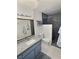 Updated bathroom featuring a granite-look vanity and modern shower with decorative black tiling at 3585 Winner Dr, Las Vegas, NV 89120