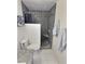 Updated bathroom featuring a toilet and modern shower with decorative black tiling at 3585 Winner Dr, Las Vegas, NV 89120