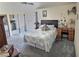 Comfortable bedroom with soft carpet flooring, a plush bed, and a view to a sliding glass door at 3585 Winner Dr, Las Vegas, NV 89120