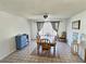 Bright dining room with neutral walls, ceiling fan, and a wooden dining table set at 3585 Winner Dr, Las Vegas, NV 89120