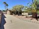 A well-maintained driveway leads to a charming home with mature palm trees and desert landscaping at 3585 Winner Dr, Las Vegas, NV 89120