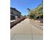 A long, private driveway leads up to this home with mature landscaping and a gated entrance at 3585 Winner Dr, Las Vegas, NV 89120