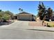 Charming single-story home with a well-maintained front yard, and attached two-car garage at 3585 Winner Dr, Las Vegas, NV 89120