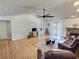 Bright living room with high ceilings, hardwood floors, fireplace, and backyard access at 3585 Winner Dr, Las Vegas, NV 89120