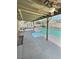 Enjoy the outdoors with a covered patio, an in-ground pool, and a spa in your backyard oasis at 3585 Winner Dr, Las Vegas, NV 89120