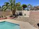 Inviting backyard pool surrounded by desert landscaping and privacy walls at 3585 Winner Dr, Las Vegas, NV 89120
