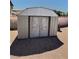 A sturdy shed with double doors provides ample outdoor storage space at 3585 Winner Dr, Las Vegas, NV 89120