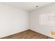 Empty room with hardwood floors, white walls, and a window at 3828 Prairie Orchid Ave, North Las Vegas, NV 89081