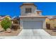 Charming two-story home features a two-car garage and desert landscaping at 3828 Prairie Orchid Ave, North Las Vegas, NV 89081