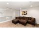 Spacious living room with plush brown sofa and lots of natural light at 3828 Prairie Orchid Ave, North Las Vegas, NV 89081