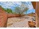 Spacious backyard featuring brick perimeter and paver patio at 4421 Galapagos Ave, North Las Vegas, NV 89084