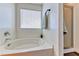Bathroom featuring a soaking tub, shower, and light from window at 4421 Galapagos Ave, North Las Vegas, NV 89084