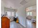 Office or bedroom space with dual work areas, wood-style floors, and bright windows at 4421 Galapagos Ave, North Las Vegas, NV 89084