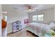 Charming bedroom with wood-look floors, natural light, and playful decor at 4421 Galapagos Ave, North Las Vegas, NV 89084